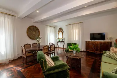 a living room with a couch and a table at Donna Maria Apartment in Rome