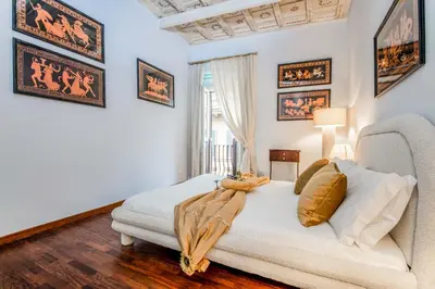 a bedroom with a white bed and a window at Donna Maria Apartment in Rome