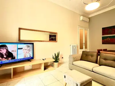 a living room with a large flat screen tv at My Roman Home - Prati Vaticano in Rome