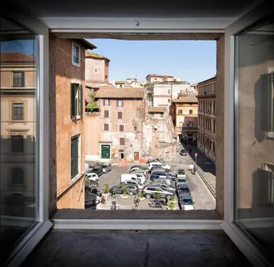 a view of a parking lot from a window at Ghetto Luxury Design Apartment in Rome