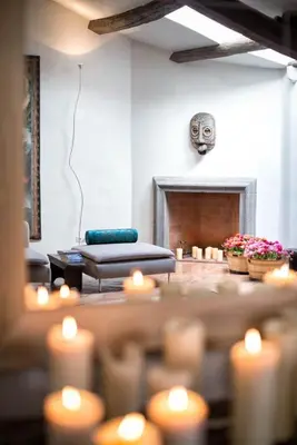 a living room with candles and a couch and a fireplace at Ghetto Luxury Design Apartment in Rome