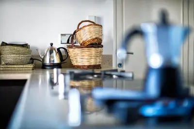 a kitchen counter with a basket on top of it at Ghetto Luxury Design Apartment in Rome