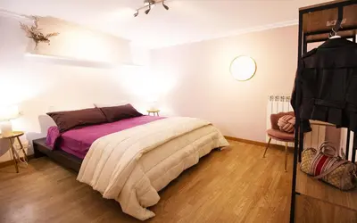 a bedroom with a bed with pillows and a window at Saint John House in Rome