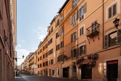 an empty street in a city with buildings at White Room with bathroom and Shared Terrace in Rome