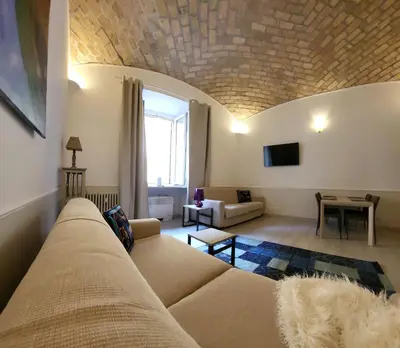 a living room with a couch and a window at Monteoppio one in Rome