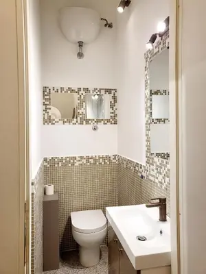 a bathroom with a toilet and a sink at Monteoppio one in Rome
