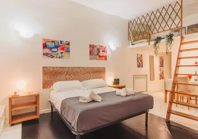 a bedroom with a bed with two pillows on it at Delizioso loft vicino Piazza del Popolo in Rome