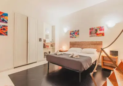 a bedroom with a bed in a room at Delizioso loft vicino Piazza del Popolo in Rome