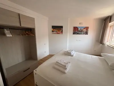 a bedroom with a bed with two towels on it at Last floor Aurelio Vaticano in Rome