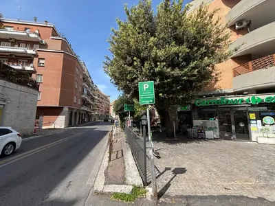 a street with a parking meter on the side of the road at Last floor Aurelio Vaticano in Rome