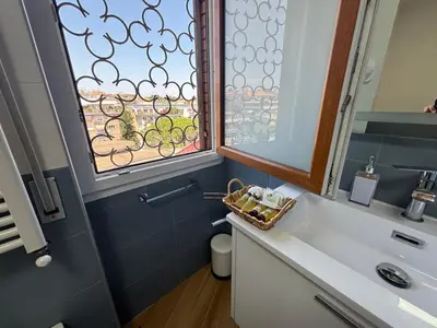 a bathroom with a sink and a window at Last floor Aurelio Vaticano in Rome