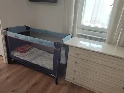 a toddlers bunk bed in a room with a dresser at casetta romana in Rome