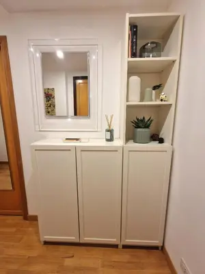 a bathroom with a mirror and a white cabinet at Casa Claudia in Rome