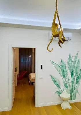 a toy monkey hanging from a wall in a room at Roma Tiburtina - Elementcity Suites in Rome