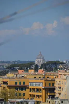a view of a city with a dome in the background at Hub in R'home in Rome