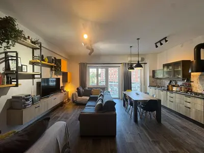 a living room with a couch and a table at Relax & Explore Stylish Apartment in Rome in Rome