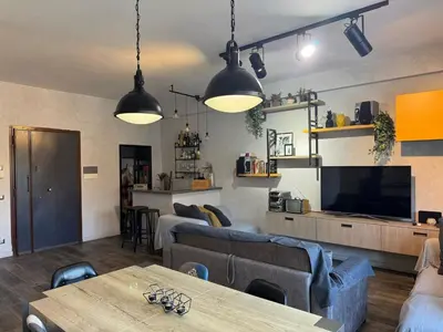 a living room with two couches and a television at Relax & Explore Stylish Apartment in Rome in Rome