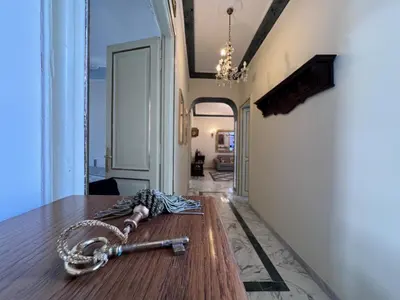 a chain laying on a table in a room at Big bright Flat - Vatican Foro Italico in Rome