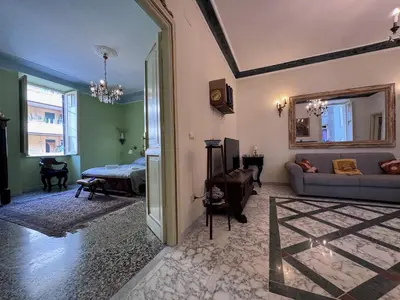 a living room with a couch and a bed at Big bright Flat - Vatican Foro Italico in Rome