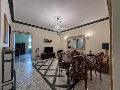 a dining room with a table and chairs at Big bright Flat - Vatican Foro Italico in Rome