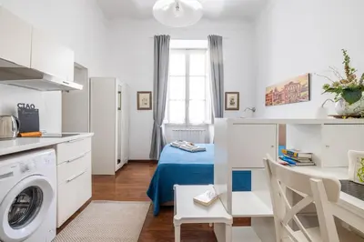 a kitchen with a washer and dryer in a room at Monti apartment in Rome