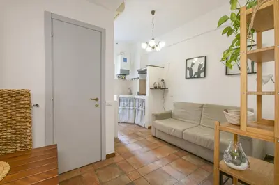 a living room with a couch and a table at BB Trastevere Station - Room1 in Rome