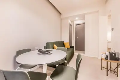 a living room with a white table and chairs at EP2000 Roman Holidays in Rome