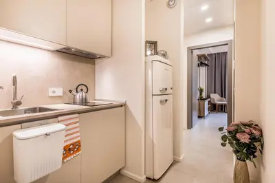 a small kitchen with a sink and a refrigerator at EP2000 Roman Holidays in Rome