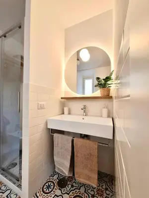 a bathroom with a sink and a mirror at Casa Sommeiller in Rome