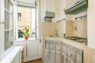 a kitchen with a sink and a stove at BB Trastevere Station - Room2 in Rome