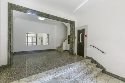 an empty hallway with a mirror and a door at BB Trastevere Station - Room3 in Rome