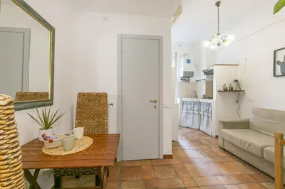 a living room with a table and a couch at BB Trastevere Station - Room3 in Rome