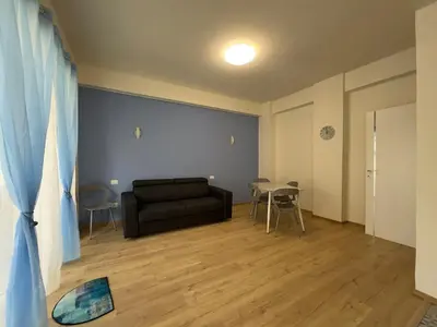 a living room with a couch and a table at Casa Emma in Rome