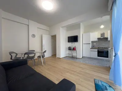 a living room with a couch and a table at Casa Emma in Rome