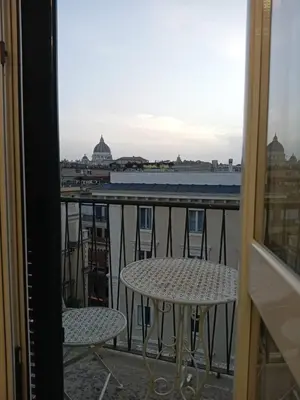 a view from a balcony with a table and chairs at Casa di Andrea 2 in San Pietro in Rome