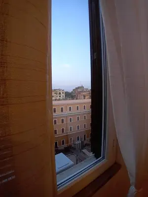 an open window with a view of a building at Casa di Andrea 2 in San Pietro in Rome