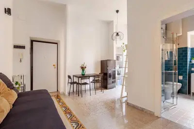 a living room with a couch and a table at RL Apartment in Rome
