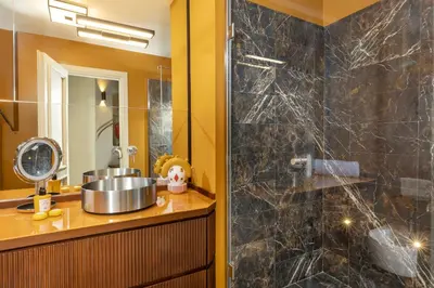 a bathroom with a sink and a shower at Torre della Luna Roma Lusso, Privacy e Piscina con Vista su San Pietro in Rome
