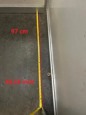 a metal door with a yellow line on the side at Gioia's Home in Rome