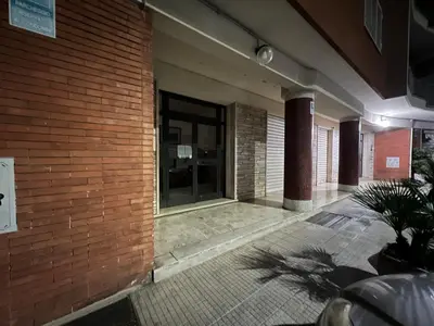 a brick building with a glass door on it at Next Stop St Peter - Apartment in Rome
