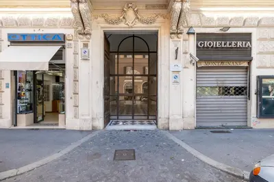 an entrance to a store with a glass door at Stylish 3BR between Vatican & City Center in Rome