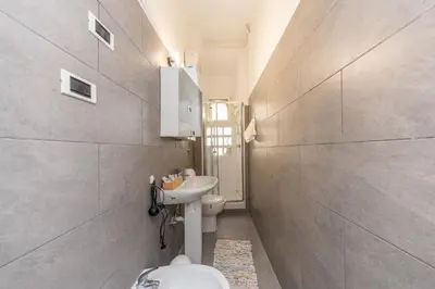 a bathroom with a toilet and a sink at San Pietro View Boutique Rooms in Rome