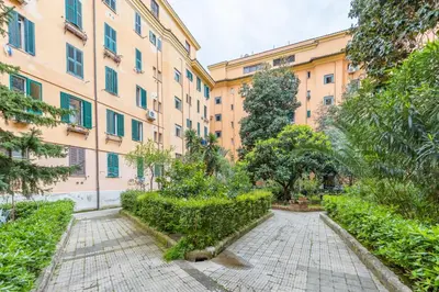 an empty street in front of a building at San Pietro View Boutique Rooms in Rome