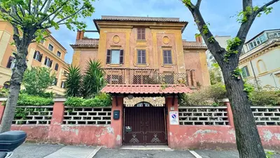 an old house with a door in front of it at Elegant suite near the Vatican in Rome