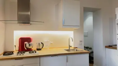 a kitchen with a red appliance on a counter at Elegant suite near the Vatican in Rome