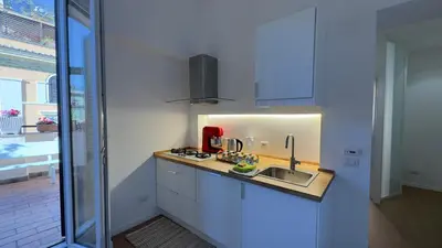 a kitchen with a sink and a red appliance at Elegant suite near the Vatican in Rome