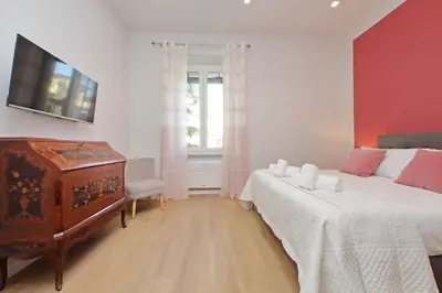 a bedroom with a bed and a dresser and a window at 4BNB - Flaminio Modern Apartment in Rome