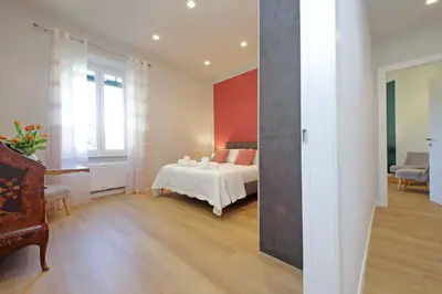 a bedroom with a bed and a living room at 4BNB - Flaminio Modern Apartment in Rome