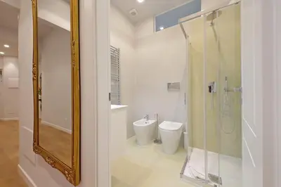 a bathroom with a glass shower and a toilet at 4BNB - Flaminio Modern Apartment in Rome