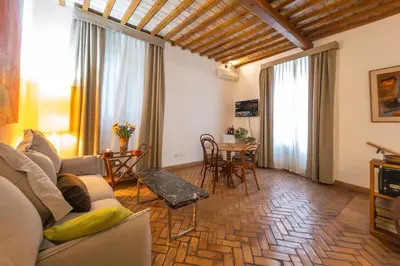 a living room with a couch and a table at Residenza a Monti in Rome